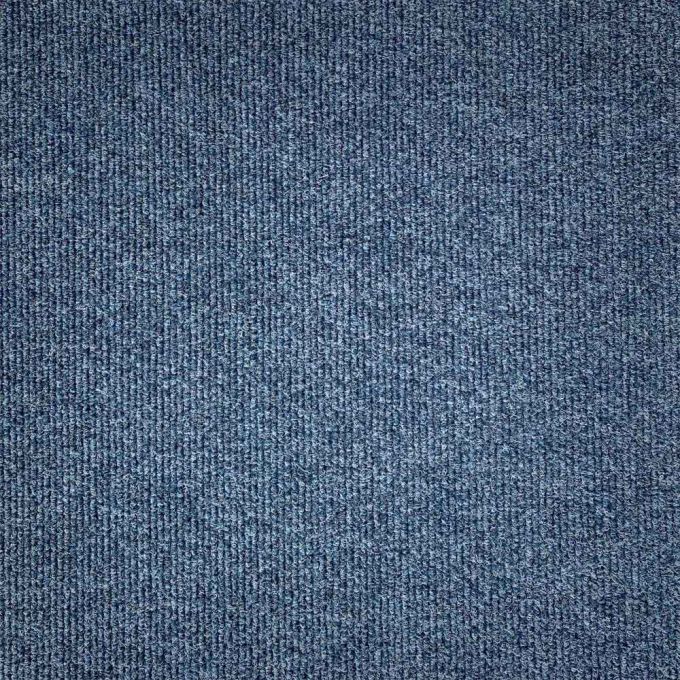 The Zetex Yukon Rib Calcium carpet tile is a durable and resilient flooring option that is perfect for high-traffic commercial and industrial spaces. The carpet tile's ribbed design is achieved through needlefelt technology and is made from 100% polypropy